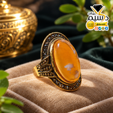 انگشتر استیل رنگ ثابت زنانه با عقیق عسلی و هاله سفید دُرسیم